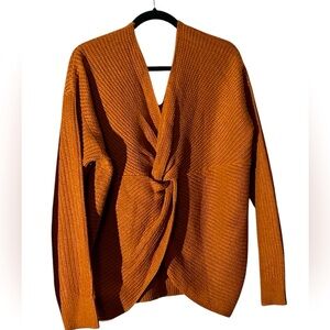 Sweater with twist design on one side